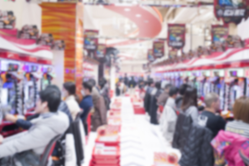 Blurred image of people playing pachinko