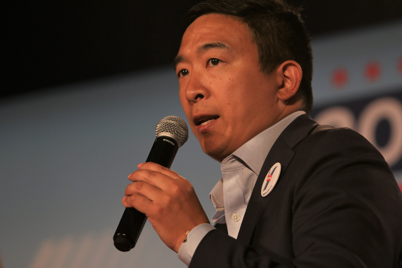 Andrew Yang speaks to the crowd at a forum for presidential candidates