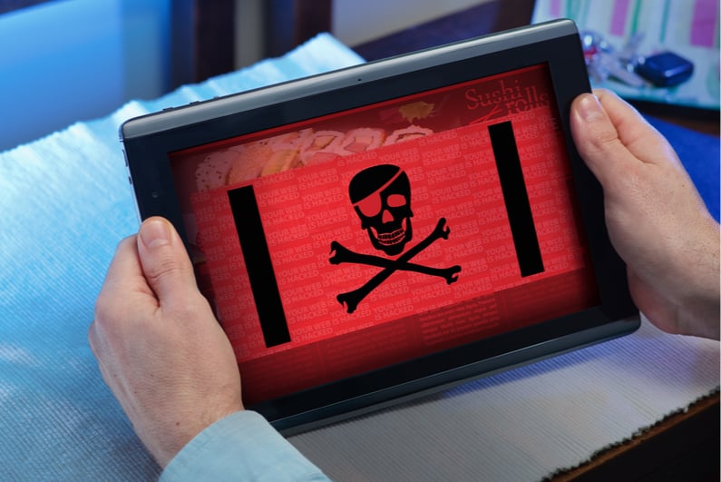 Tablet displaying a skull and crossbones