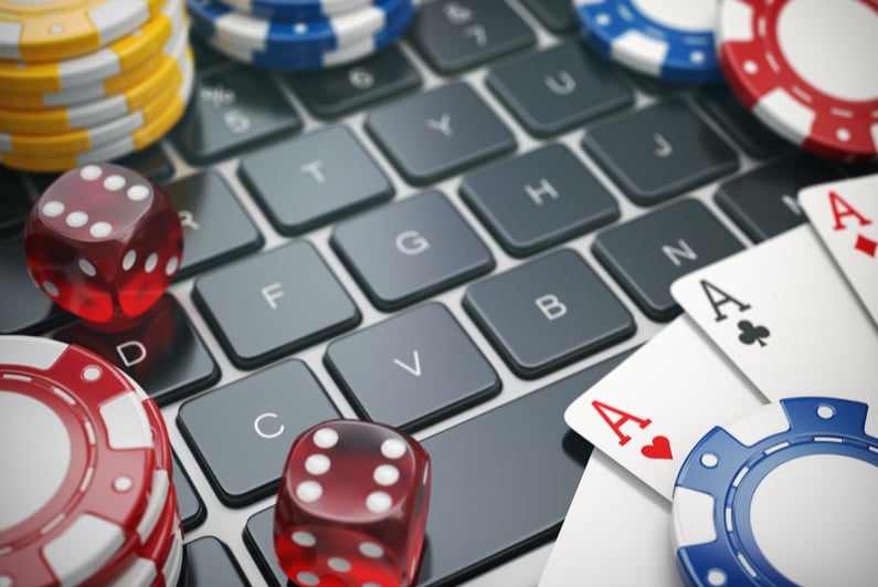 gambling accessories on a laptop keyboard