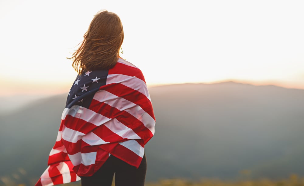 woman wrapped in a US flag