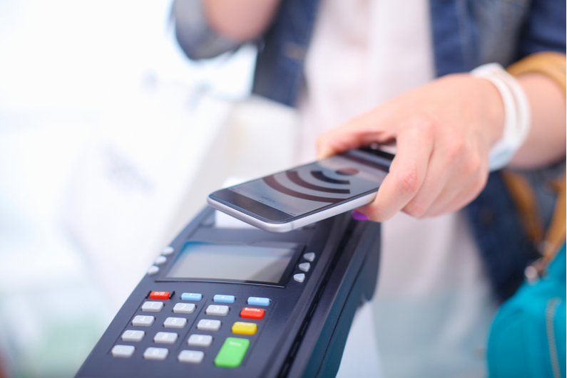 Person paying with phone