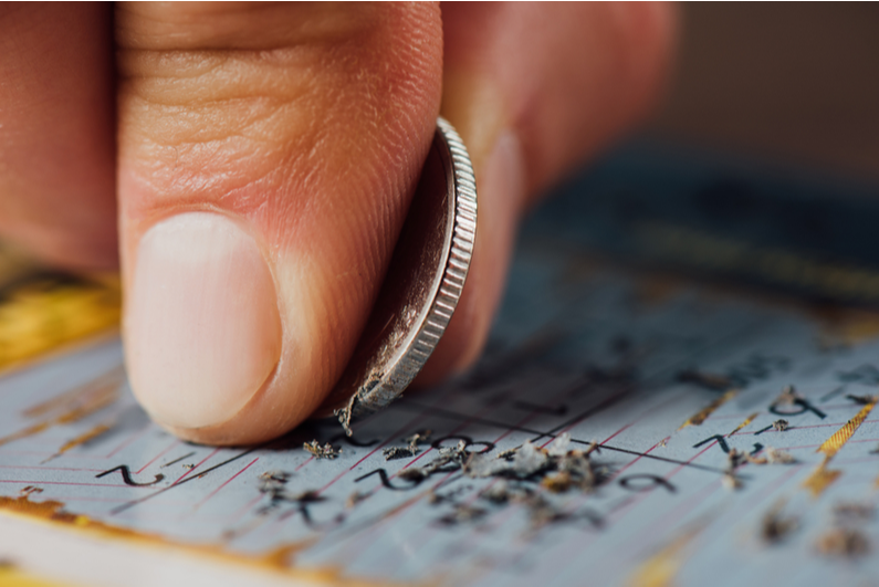 Person playing a scratch card